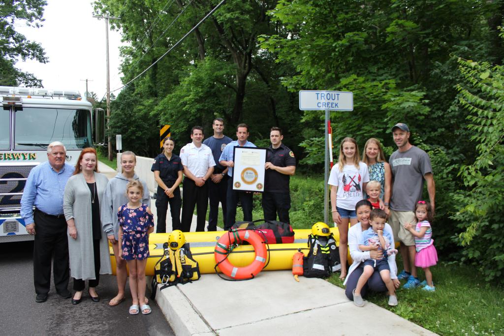 Berwyn rescuers are joined by Glenhardie residents near the Trout Creek crossing in the area of Walker Rd. and West Valley Rd. in Tredyffrin Township.
