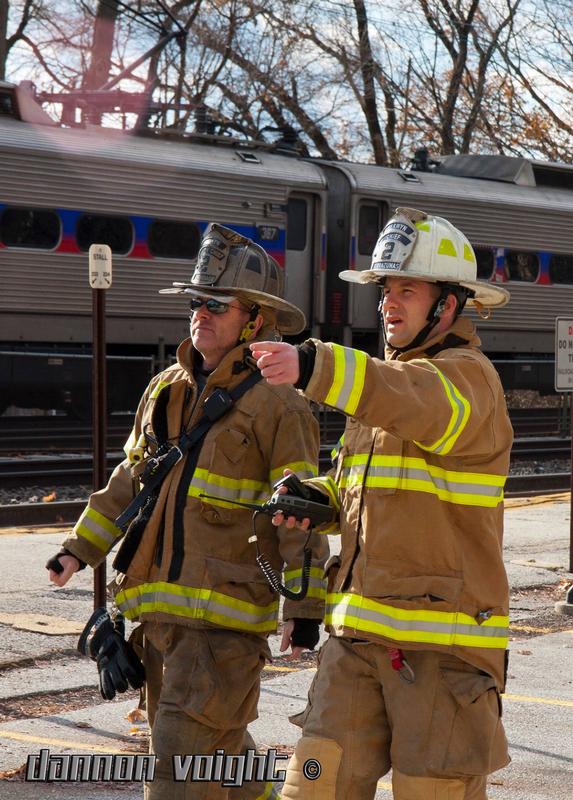 Deputy Chief Justin Brundage and Fire Chief Eamon Brazunas during a fire on Christmas Day at the Devon Train Station in 2017.