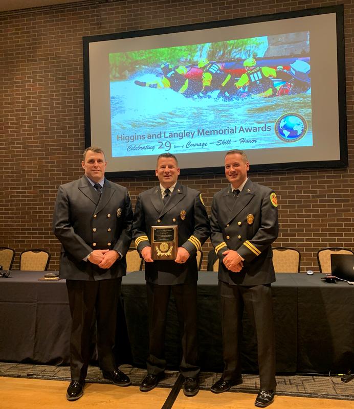 Berwyn Firefighter/Paramedic Albert Brawn, IV, Assistant Chief Eamon Brazunas and Battalion Chief Evan Brazunas receiving an Incident Award at the Higgins & Langley Memorial Awards ceremony in South Bend, Indiana on Sunday, June 12, 2022. 