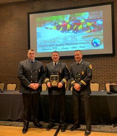 Berwyn Firefighter/Paramedic Albert Brawn, IV, Assistant Chief Eamon Brazunas and Battalion Chief Evan Brazunas receiving an Incident Award at the Higgins & Langley Memorial Awards ceremony in South Bend, Indiana on Sunday, June 12, 2022. 