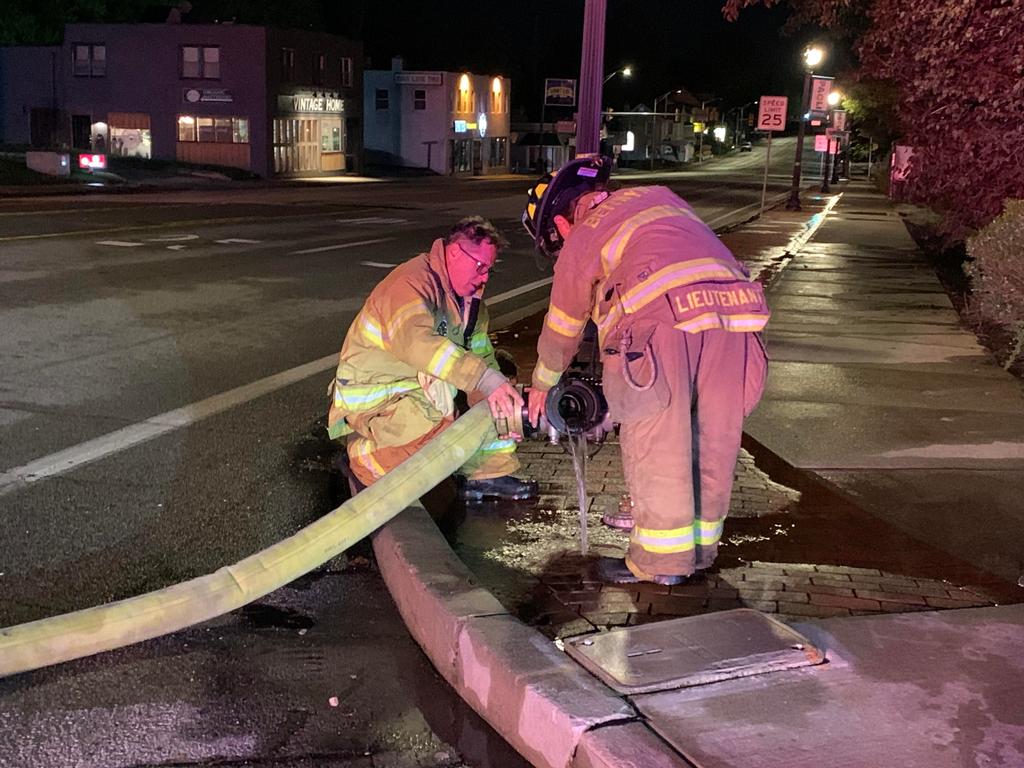 FF/Medic Eric Sharpe and Lt. Sheryl Drach breaking down the fire hydrant.