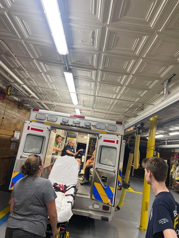 Volunteers reviewing equipment in the back of one of the four ambulances that carry Basic Life Support and Advanced Life Support equipment. 