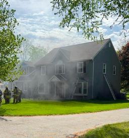 Firefighters work to extinguish a basement fire in the 400 block of Red Coat Lane in Tredyffrin Township. 