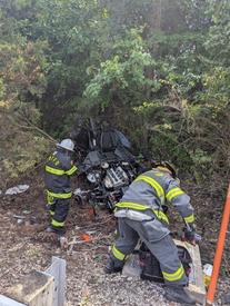 Rescuers cleaning up equipment post-rescue on Route 202 in Tredyffrin Township.
